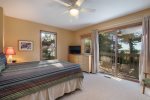 Master bedroom ensuite with a balcony and TV